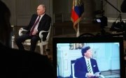 Путін та Карлсон